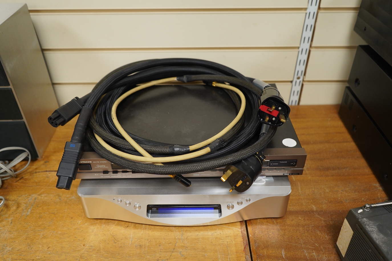 An Esoteric RZ-1 Integrated Music System, amplifier SACD/CD player, together with a Hitachi FT-5500 AM/FM stereo tuner, plus cables.